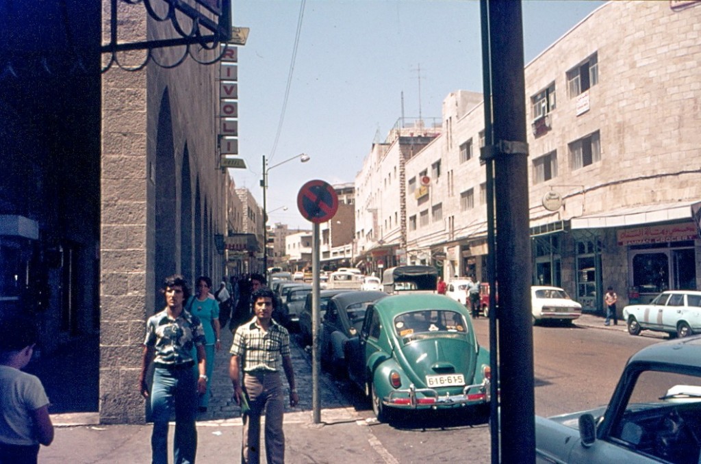 a street scene, then and now, in an undecided place
