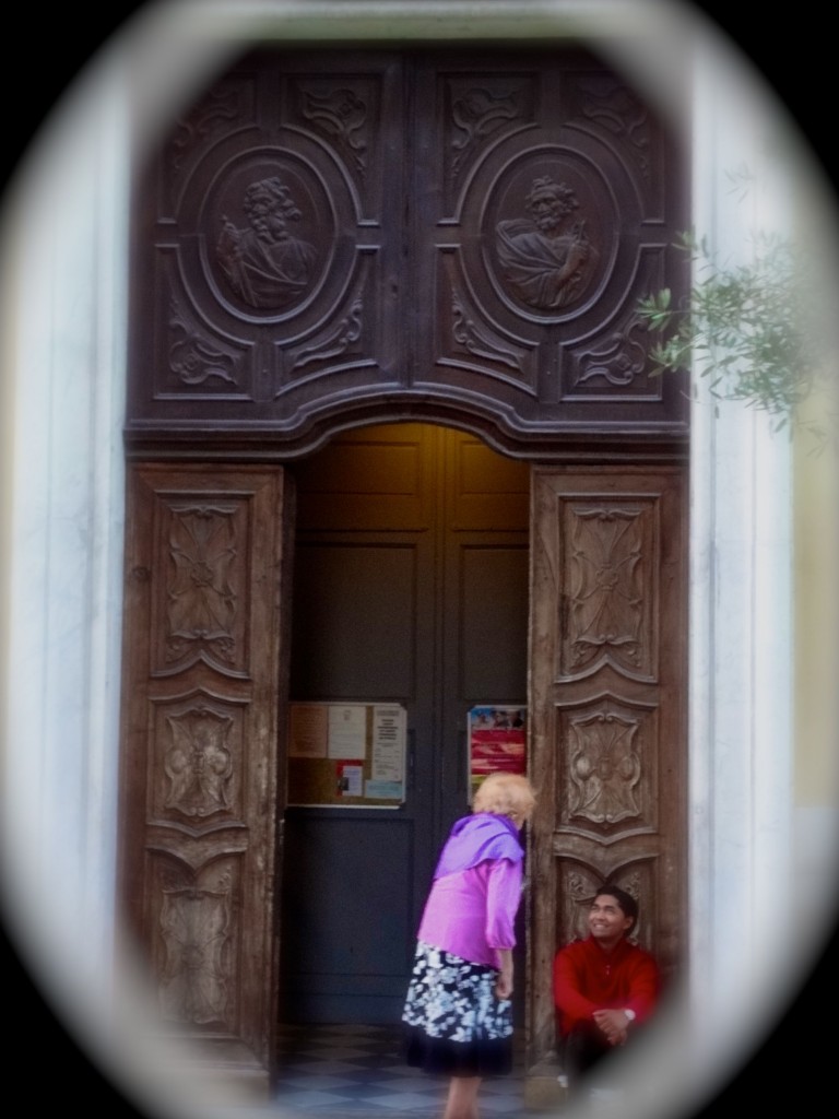 a streetside postcard of a doorway dialogue